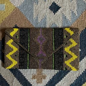 Amazing beaded clutch goes with so many colors -yellow bronze black green purple